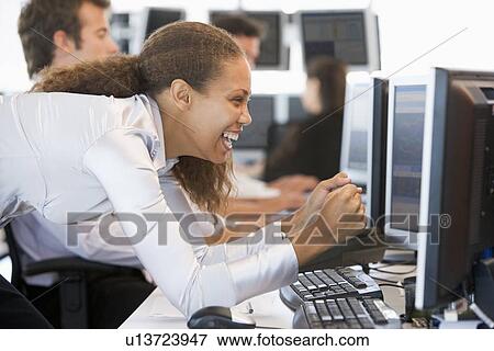 Stock Trader Overjoyed Looking At Monitor View Large Photo Image Stock Photo - Stock Trader Overjoyed Looking At Monitor. Fotosearch