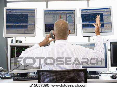 Stock Trader Talking Animatedly On The Phone View Large Photo Image Stock Image - Stock Trader Talking Animatedly On The Phone. Fotosearch