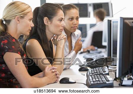 Picture - Stock Trader Team At Work. Fotosearch