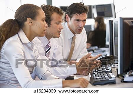 Stock Trader Team At Work View Large Photo Image Stock Photo - Stock Trader Team At Work. Fotosearch
