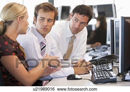 Stock Photograph - Stock Trader Team At Work. Fotosearch