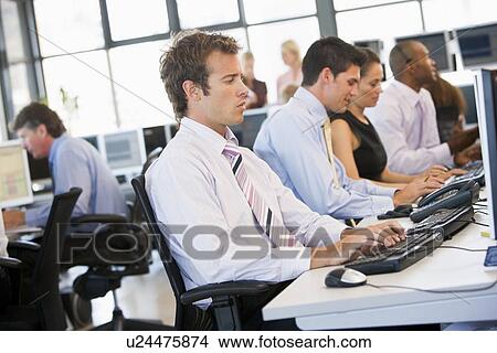 Stock Traders At Work View Large Photo Image Picture - Stock Traders At Work. Fotosearch