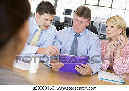Stock Photograph - Stock Traders Conducting Interview. Fotosearch