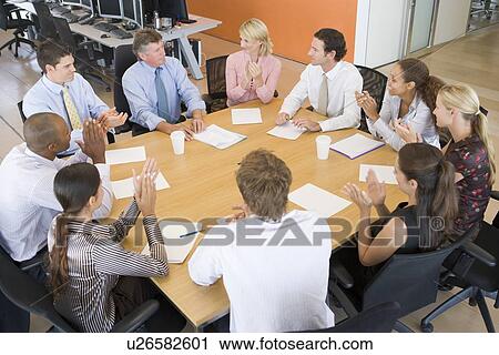 Stock Image - Stock Traders In A Meeting. Fotosearch