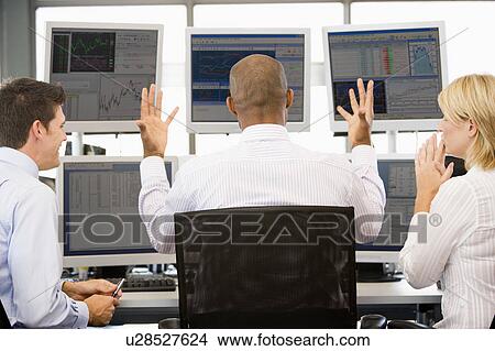 Stock Traders Viewing Monitors View Large Photo Image Picture - Stock Traders Viewing Monitors. Fotosearch