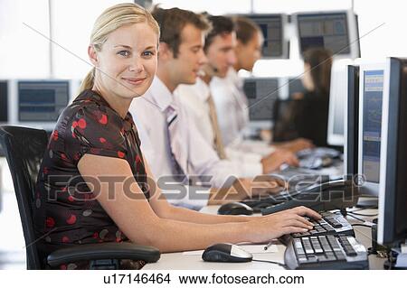 Picture - Stock Traders Working At Computers. Fotosearch