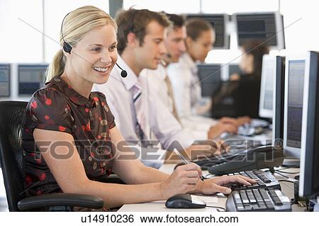 Stock Photograph - Stock Traders Working At Computers. Fotosearch