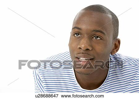 Stock Photo - Studio Portrait Of Smiling Teenage Boy. Fotosearch