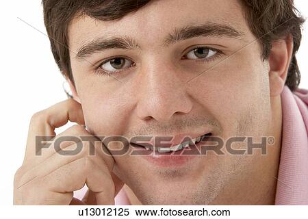 Stock Photography - Studio Portrait Of Smiling Teenage Boy. Fotosearch