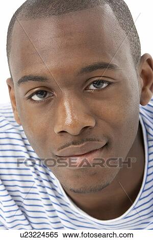 Stock Photography - Studio Portrait Of Smiling Teenage Boy. Fotosearch