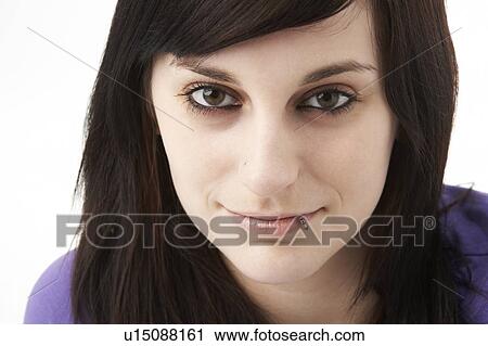 Stock Image - Studio Portrait Of Smiling Teenage Girl. Fotosearch