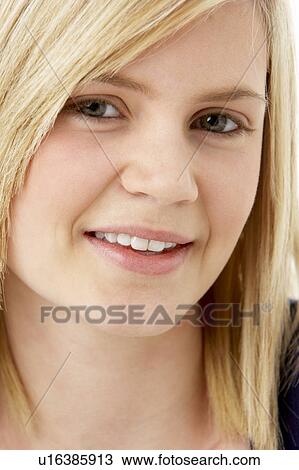 Studio Portrait Of Smiling Teenage Girl View Large Photo Image Stock Image - Studio Portrait Of Smiling Teenage Girl. Fotosearch