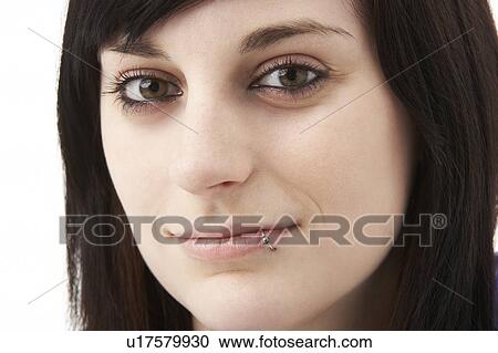 Stock Image - Studio Portrait Of Smiling Teenage Girl. Fotosearch