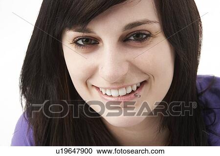 Stock Image - Studio Portrait Of Smiling Teenage Girl. Fotosearch
