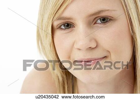 Stock Image - Studio Portrait Of Smiling Teenage Girl. Fotosearch