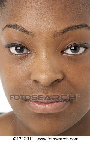 Stock Image - Studio Portrait Of Smiling Teenage Girl. Fotosearch
