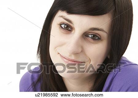Stock Image - Studio Portrait Of Smiling Teenage Girl. Fotosearch