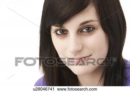 Stock Image - Studio Portrait Of Smiling Teenage Girl. Fotosearch
