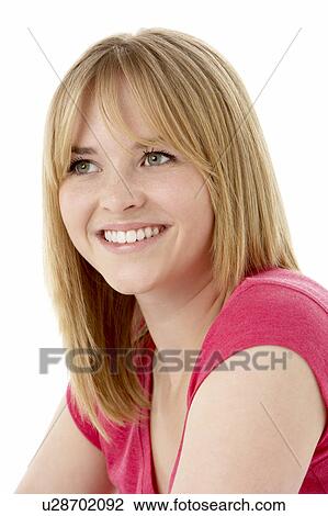 Stock Image - Studio Portrait Of Smiling Teenage Girl. Fotosearch