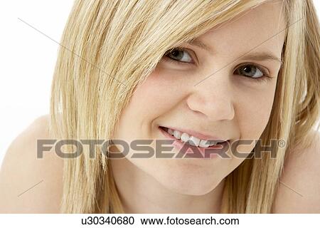 Stock Image - Studio Portrait Of Smiling Teenage Girl. Fotosearch