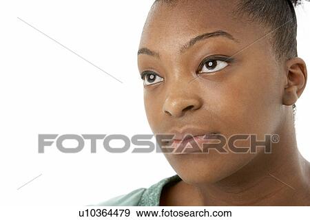 Stock Photo - Studio Portrait Of Smiling Teenage Girl. Fotosearch