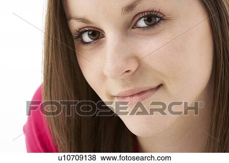 Stock Photo - Studio Portrait Of Smiling Teenage Girl. Fotosearch