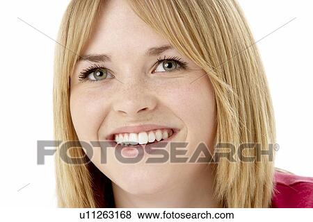 Stock Photo - Studio Portrait Of Smiling Teenage Girl. Fotosearch