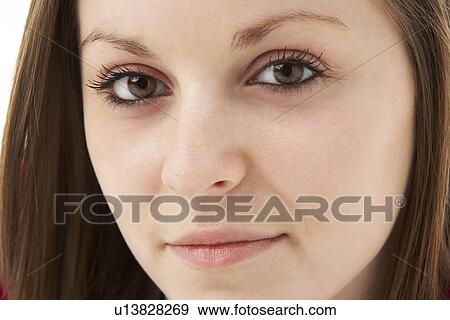 Stock Photo - Studio Portrait Of Smiling Teenage Girl. Fotosearch