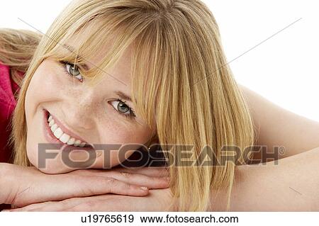 Stock Photo - Studio Portrait Of Smiling Teenage Girl. Fotosearch