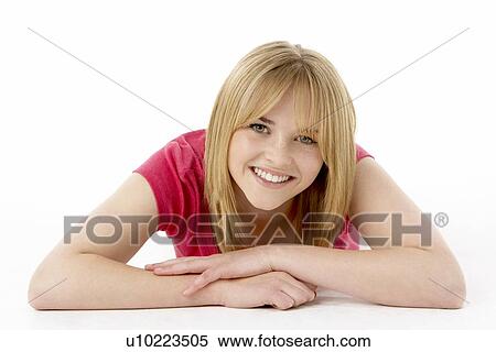 Stock Photography - Studio Portrait Of Smiling Teenage Girl. Fotosearch