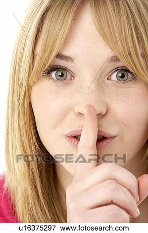 Stock Photo - Studio Portrait Of Surprised Teenage Girl. Fotosearch