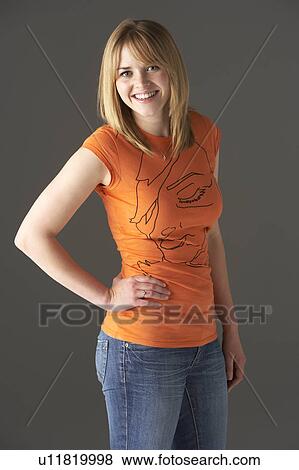 Studio Portrait Of Teenage Girl Sitting In Chair View Large Photo Image Stock Photo - Studio Portrait Of Teenage Girl Sitting In Chair. Fotosearch