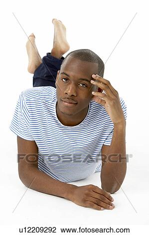 Teenage Boy Laying On Stomach View Large Photo Image Stock Image - Teenage Boy Laying On Stomach. Fotosearch
