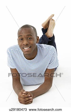 Teenage Boy Laying On Stomach View Large Photo Image Stock Image - Teenage Boy Laying On Stomach. Fotosearch