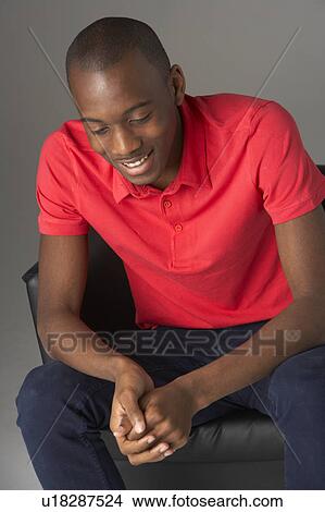 Teenage Boy Seated In Studio View Large Photo Image Picture - Teenage Boy Seated In Studio. Fotosearch