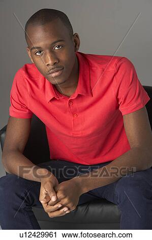 Teenage Boy Seated In Studio View Large Photo Image Stock Image - Teenage Boy Seated In Studio. Fotosearch