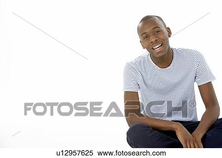 Teenage Boy Sitting In Studio View Large Photo Image Stock Photography - Teenage Boy Sitting In Studio. Fotosearch