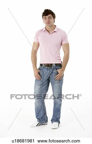 Stock Image - Teenage Boy Standing In Studio. Fotosearch
