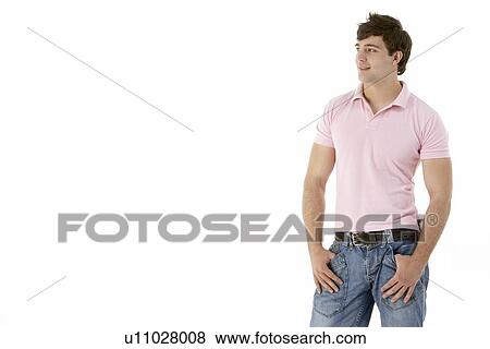 Stock Photo - Teenage Boy Standing In Studio. Fotosearch