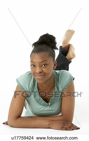 Picture - Teenage Girl Laying On Stomach. Fotosearch
