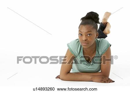 Stock Image - Teenage Girl Laying On Stomach. Fotosearch