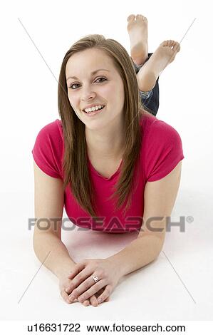 Stock Image - Teenage Girl Laying On Stomach. Fotosearch