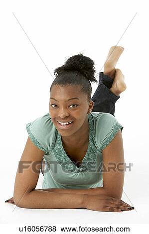 Teenage Girl Laying On Stomach View Large Photo Image Stock Photo - Teenage Girl Laying On Stomach. Fotosearch