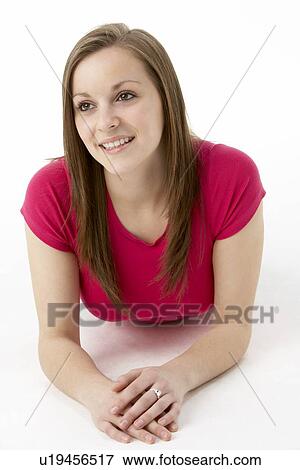 Stock Photo - Teenage Girl Laying On Stomach. Fotosearch