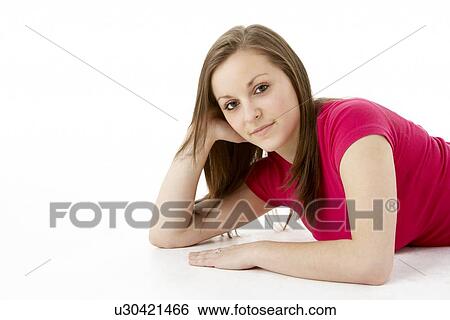 Stock Photograph - Teenage Girl Laying On Stomach. Fotosearch
