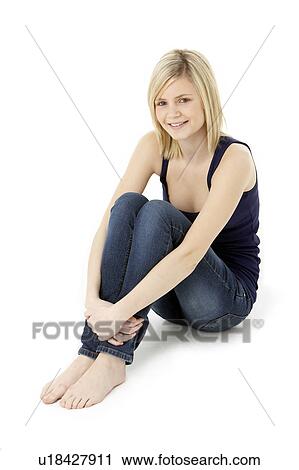 Stock Image - Teenage Girl Sitting In Studio. Fotosearch