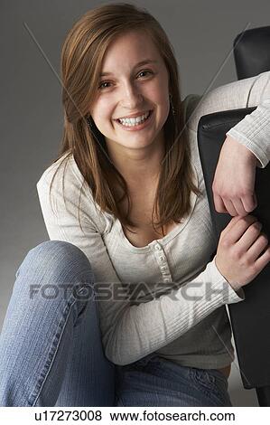 Teenage Girl Sitting In Studio View Large Photo Image Stock Photo - Teenage Girl Sitting In Studio. Fotosearch