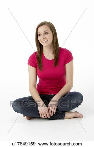 Stock Photo - Teenage Girl Sitting In Studio. Fotosearch
