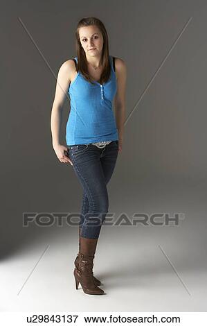 Stock Photo - Teenage Girl Standing In Studio. Fotosearch