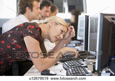 Stock Photo - Woman Looking At Monitor Frustrated. Fotosearch